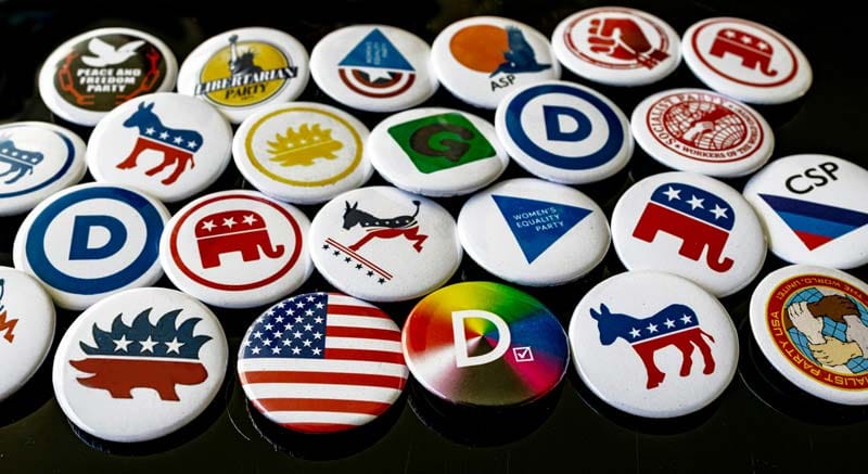 25 political buttons for various parties and organizations.